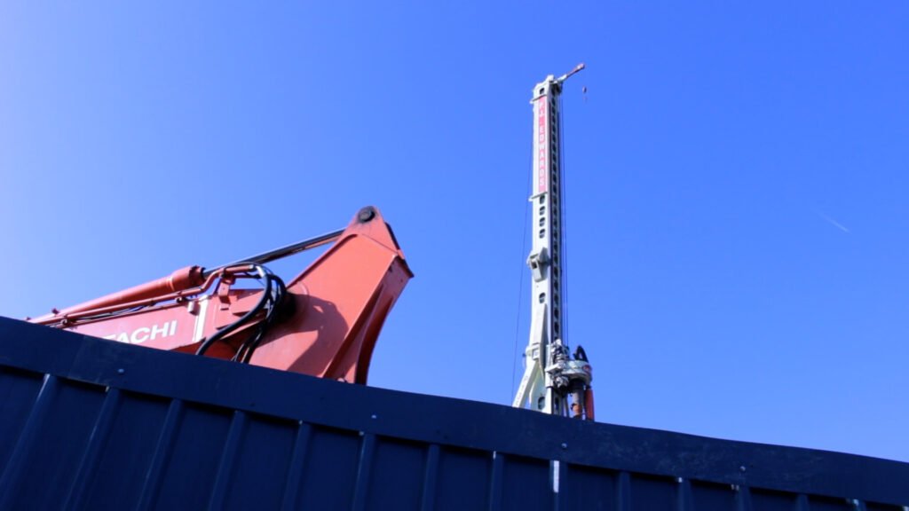 crane peeping over blue